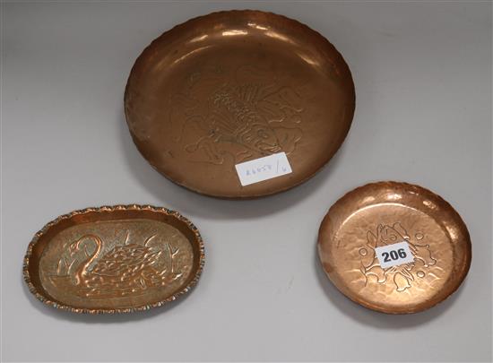 Two Newlyn copper fish dishes and a swan dish